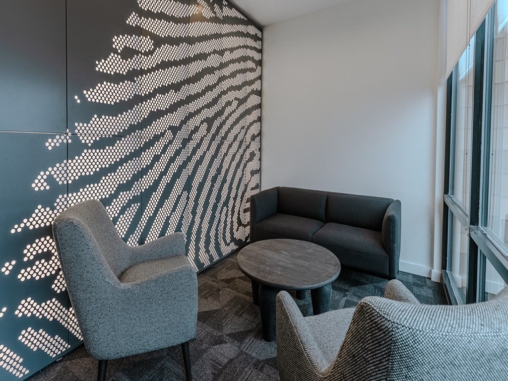 a living room with a couch and chairs and a table